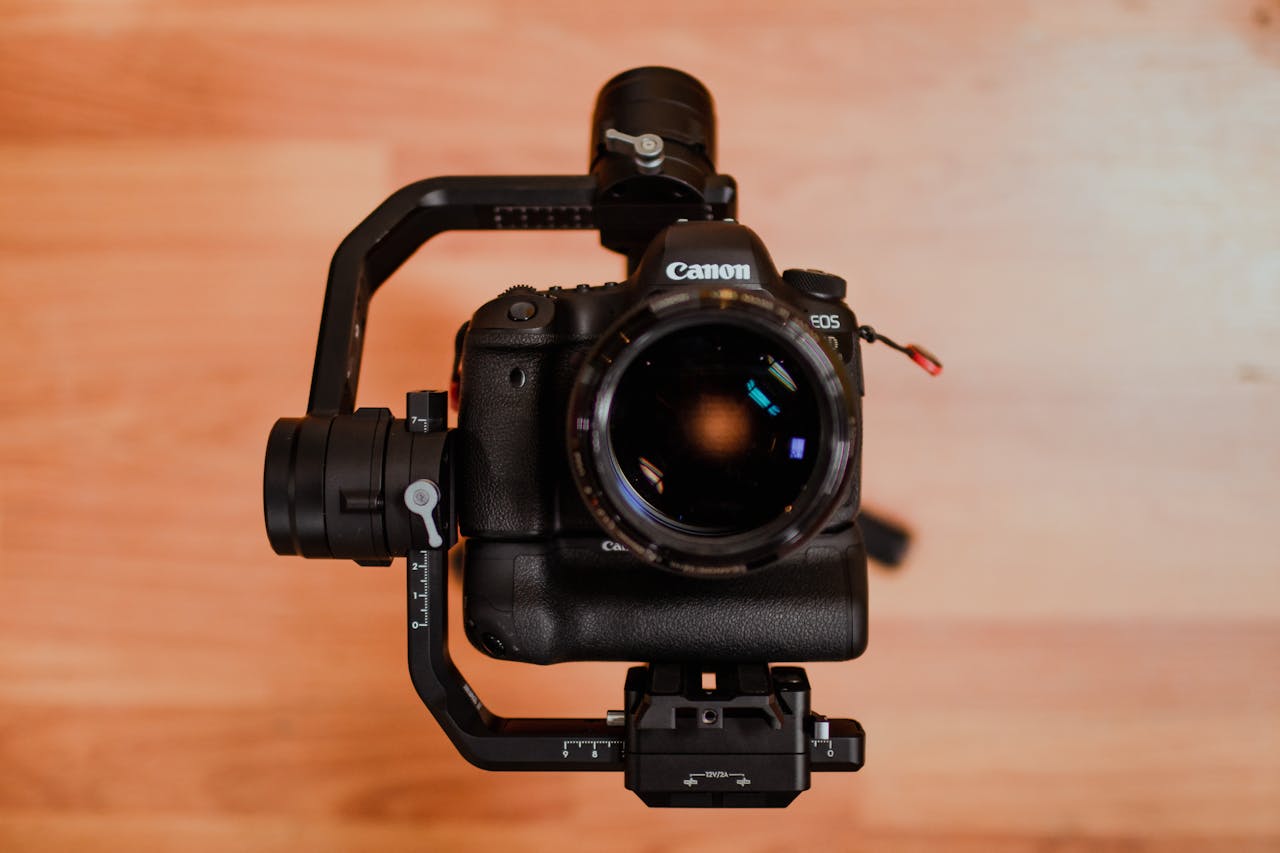 Crafting Captivating Headlines: Your awesome post title goes here Top view of a professional DSLR camera mounted on a gimbal, highlighting modern photography equipment.