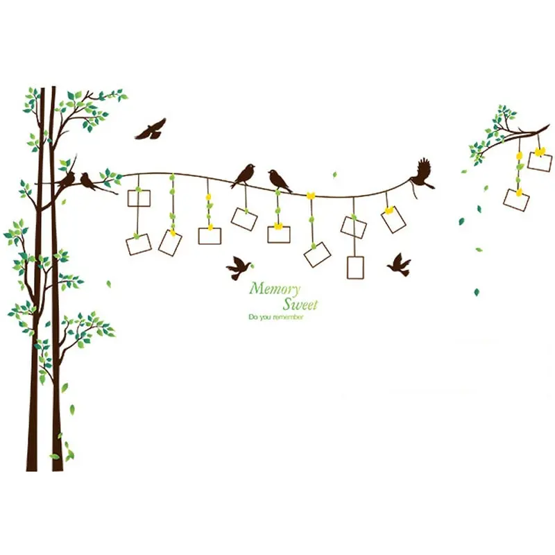 wallsticker-med-plads-til-fotos Sød og hyggelig wallsticker med fugle og træer med plads til dine egne fotos. -